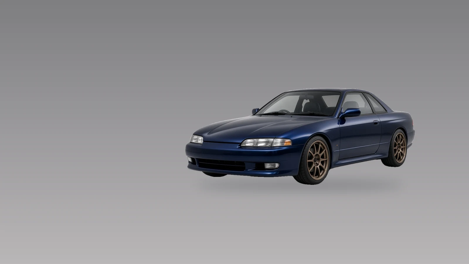 Coupé sportif japonais bleu foncé en studio